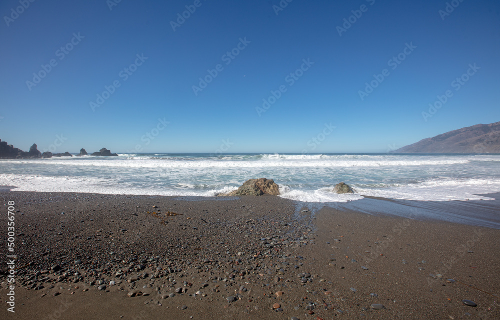 Gravel strewn on beach at the Original Ragged Point at Big Sur on the Central Coast of California United States Gravel strewn on beach at the Original Ragged Point at Big Sur on the Central Coast of California United States