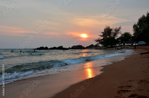 View landscape seascape of Chao Lao sand beach and wave water in sea ocean at sunset dusk time for thai people and foreign travelers travel visit and rest relax play swimming at Chanthaburi  Thailand