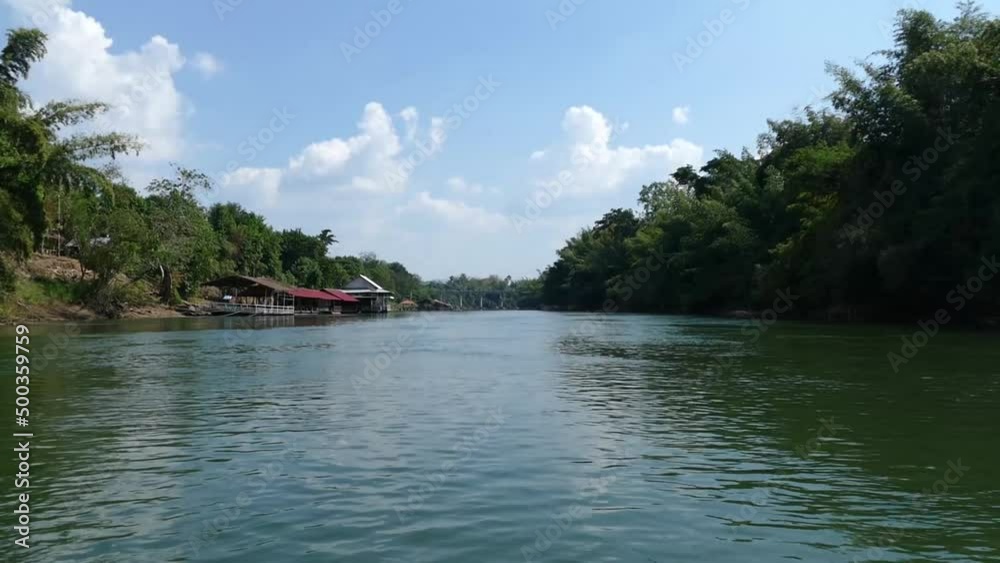 Riverboat trip on the river Kwai, Thailand. First person view. Lazy river boat ride in Asia Riverboat trip on the river Kwai, Thailand. First person view. Lazy river boat ride in Asia