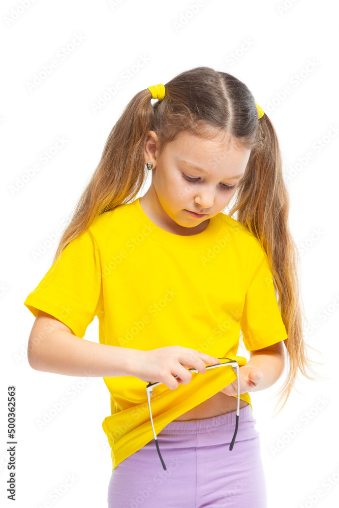 Little cute girl wipes glasses. Glasses fogged up, glass cleaned. Isolated on white background. Little cute girl wipes glasses. Glasses fogged up, glass cleaned. Isolated on white background.