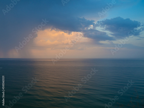 Morning landscape with cloudy sky and ripples at sea in Yemen. Beautiful colorful seascape. Wide deep blue sea ocean ripples. Nautical background