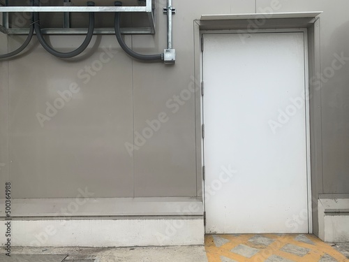 Industrial doors White work. White on the metal wall