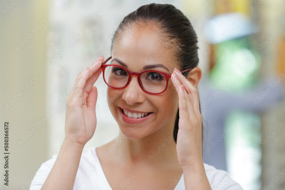 young woman testing new glasses light effect young woman testing new glasses light effect