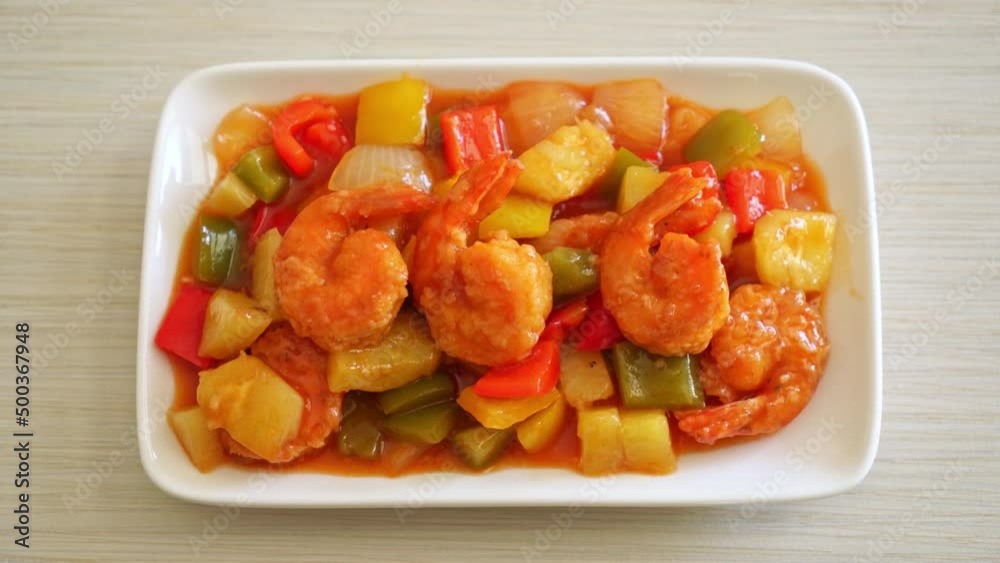 Stir-fried sweet and sour with fried shrimp on plate - Asian food style
