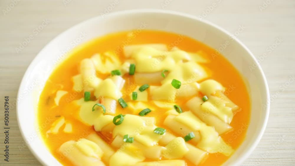 tteokbokki with cheese or Korean rice cake with cheese - Korean food style tteokbokki with cheese or Korean rice cake with cheese - Korean food style