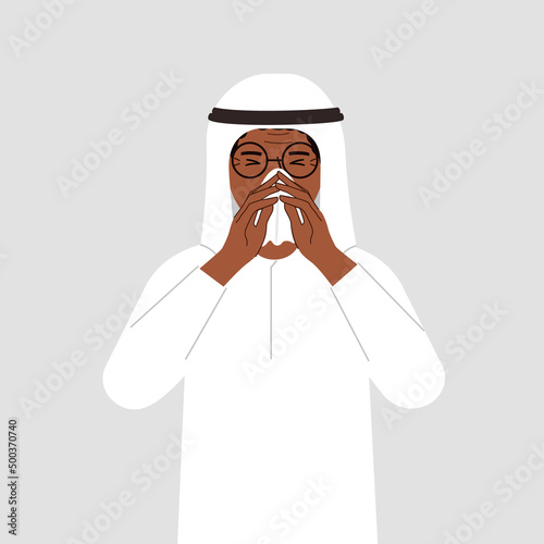 A man covers his nose with his hands with a handkerchief. The concept of a sick person, sneezing, seasonal allergies, bad smell.