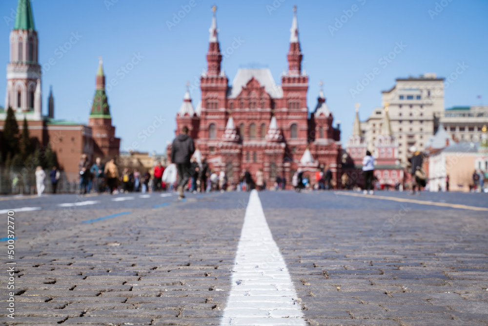 Photography with selective focus. Moscow Red Square, people, sky and pavement. Spring sunset. Natural background. High quality photo