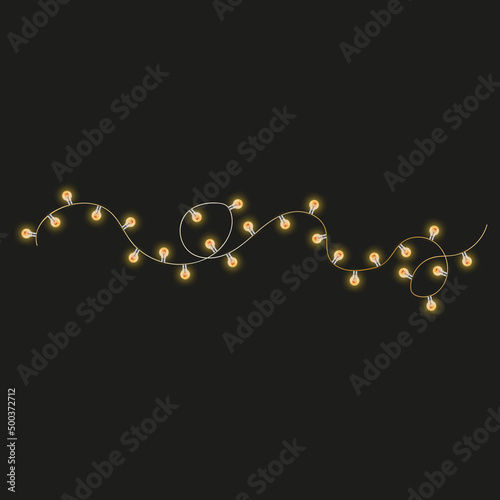 electric garland of incandescent lamps on a black background