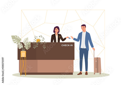 Businessman With Luggage Checking-In At A Luxury Hotel With The Cheerful Receptionist At The Front Desk.