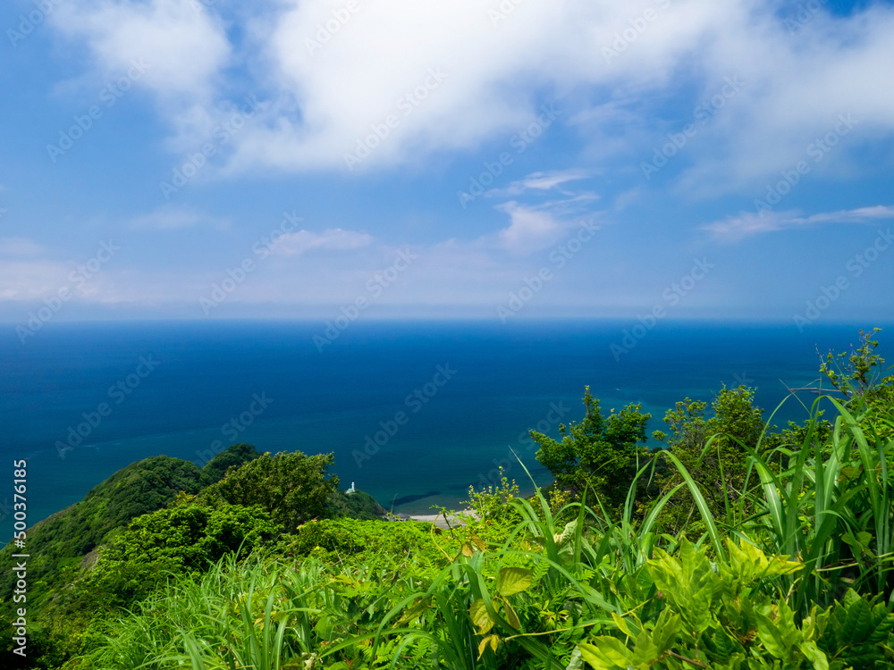 Overlooking sea and a lighthouse in cape from mountain (Mt.Kakuda, Nishikan, Niigata, Japan)