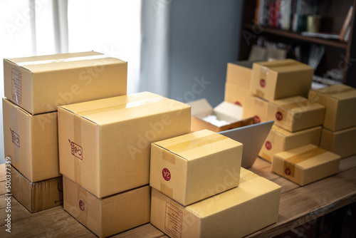 Packing products for delivery, shipping service. Delivery concept for private companies delivery with care, Craft present box. Online shopping. Packed household stuff for moving into new house. © 22January