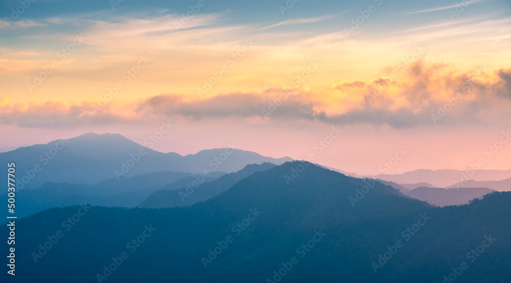 mountain background with colorful sky. rainforest in winter season with mountain range, pine tree in the jungle. stunning landscape in the world. south east Asia nature with national park. camping.