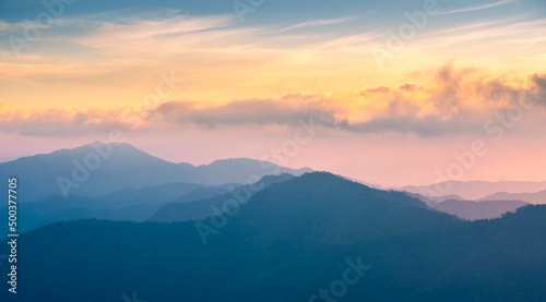 mountain background with colorful sky. rainforest in winter season with mountain range, pine tree in the jungle. stunning landscape in the world. south east Asia nature with national park. camping.