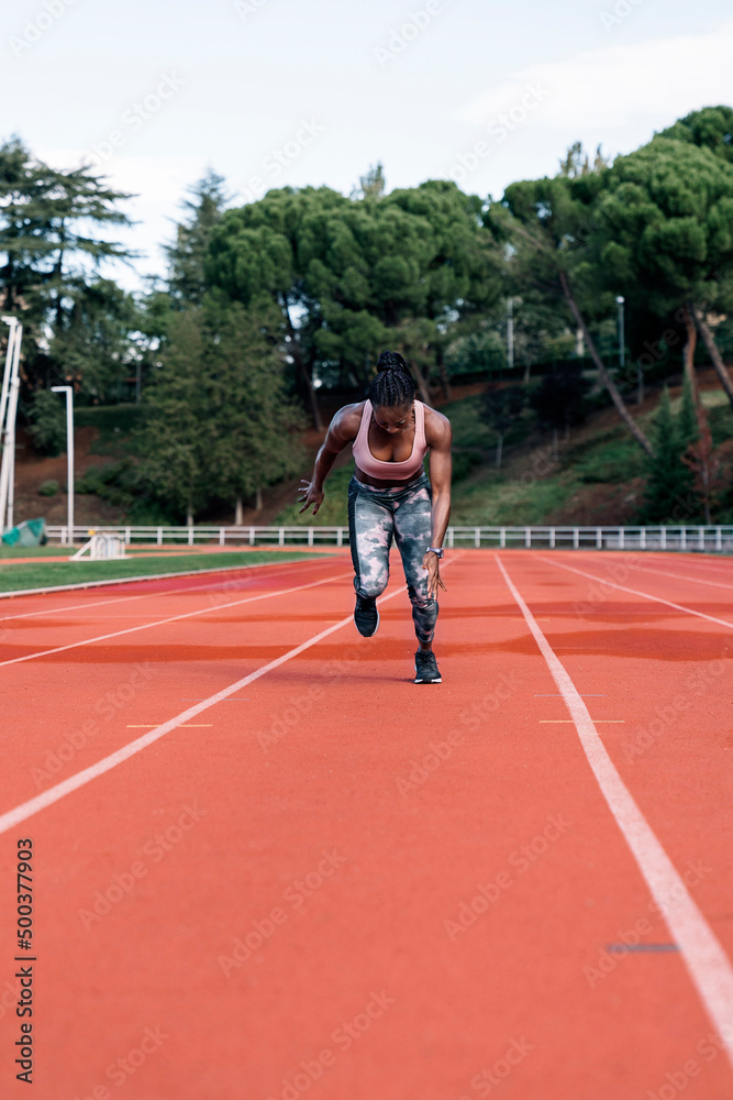 Young black athlete sprinter running