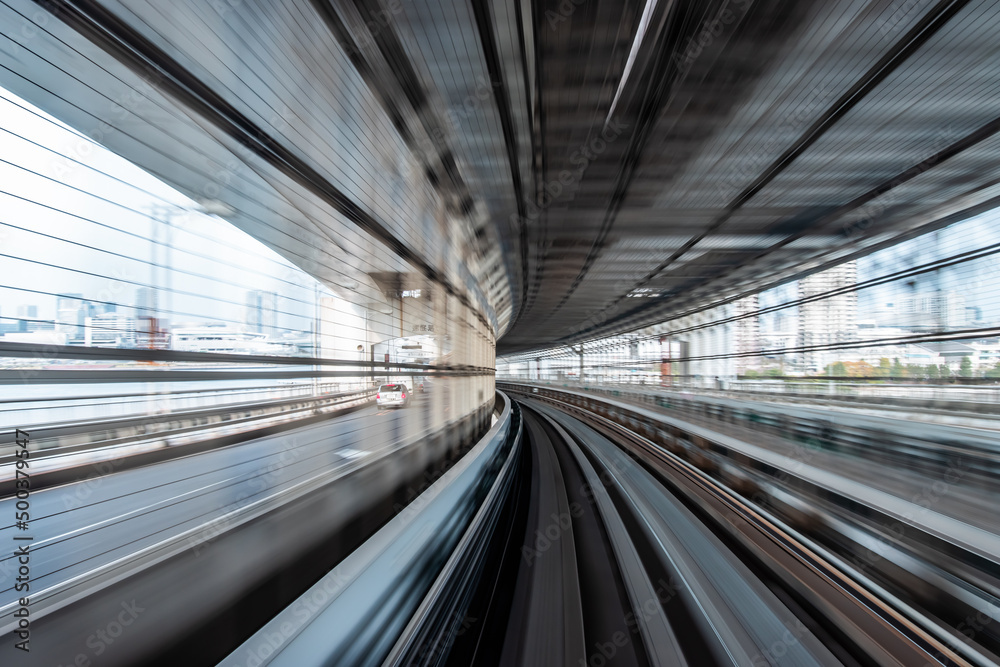 Long exposure motion blur from Yurikamome Monorail line in Tokyo, Japan. Abstract for Digital, Technology, Futuristic Transportation, Computer Network, and Communication concept.