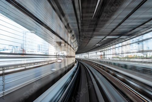 Long exposure motion blur from Yurikamome Monorail line in Tokyo, Japan. Abstract for Digital, Technology, Futuristic Transportation, Computer Network, and Communication concept.