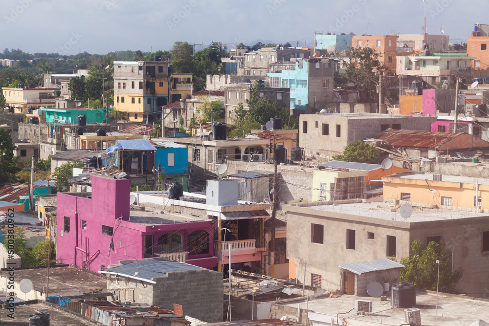 Colorful living houses in poor district of Santo Domingo, aerial view