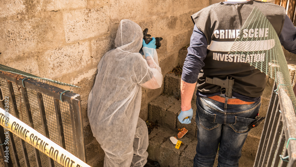 investigations into the kidnapping of the child with CSI investigators who collect scientific evidence and photograph the scene of the crime investigations into the kidnapping of the child with CSI investigators who collect scientific evidence and photograph the scene of the crime