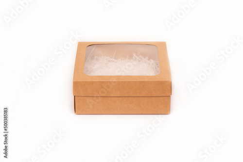 Mocap. Gift box made of cardboard and a transparent window on top on a white background.