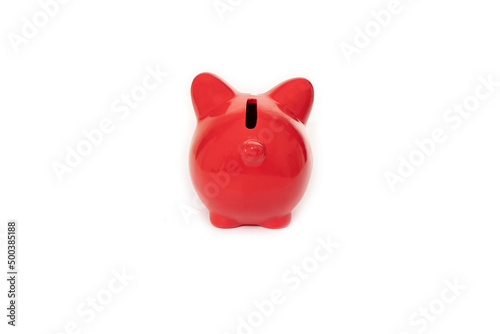 Mocap. Piggy bank of red color for storing savings and money back view.
