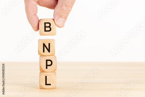 BNPL message on wooden blocks. Buy now pay later concept. Copy space