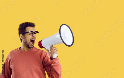 Vászonkép Man shouting in megaphone