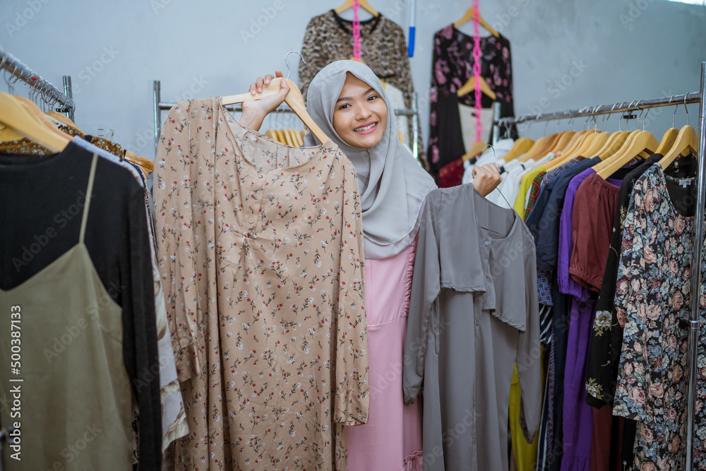 beautiful muslim woman shopping new dress for eid mubarak idul fitri