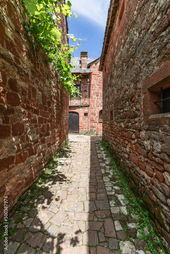 Narrowest cobblestone back street of   Collonges-la-Rouge squeezed between 2 masonry walls. Correze department  New Aquitaine region  France