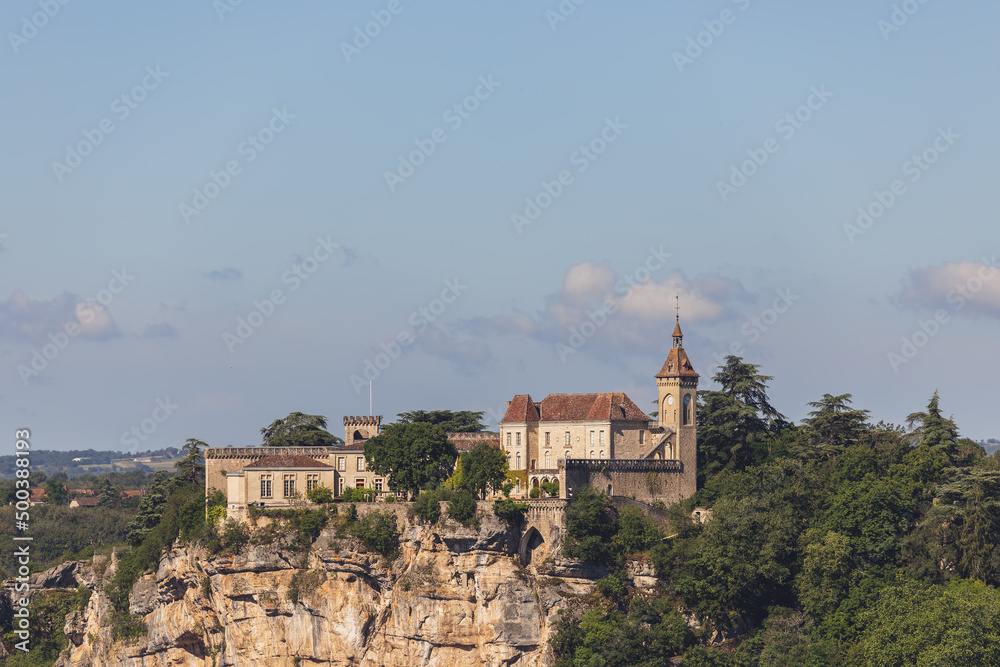 Panoramic view of bishop palace or Rocamadour castle on cliff. Lot, Occitania, Southwestern France