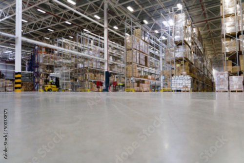blur warehouse inventory with tall shelves store warehouse. logistic background.