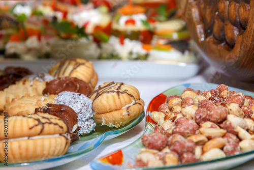 Set of different nuts and sweets on a table. Catering food party.