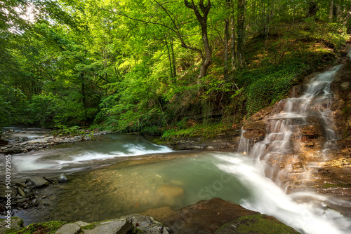 beautiful waterfall in green forest in the mountain, Bulgaria