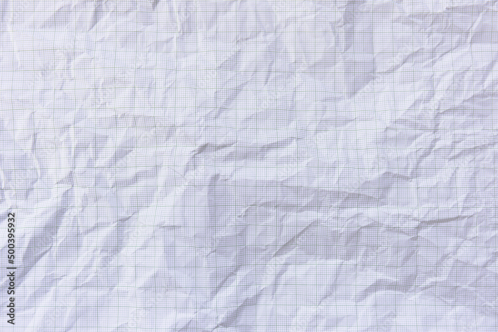 Square crumpled square graph paper on the background. Square crumpled square graph paper on the background.