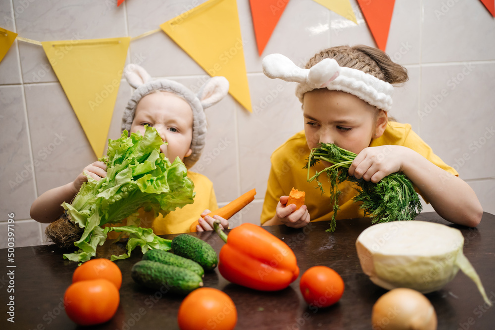 children in rabbit ears eat herb dill vegetables Easter children in rabbit ears eat herb dill vegetables Easter