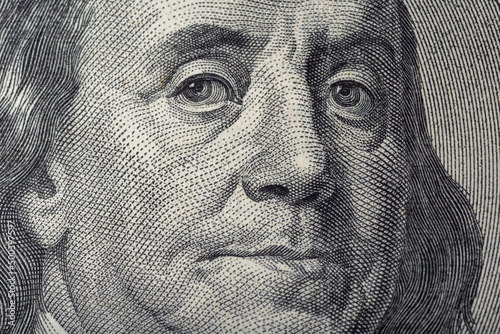 Portrait of Ben Franklin on the US 100 dollar bill in macro. Benjamin Franklin on hundred dollar American banknote