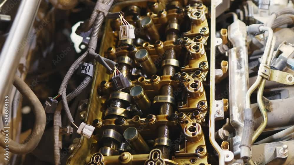closeup car engine valvematic cover inside and outside, repairmen