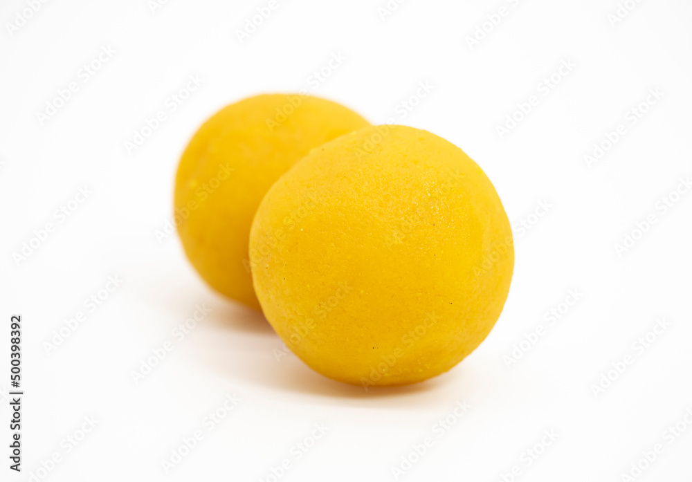 selective focus ,Motichoor laddoo Also Know as Bundi Laddu or Motichur Laddoo isolate on white selective focus ,Motichoor laddoo Also Know as Bundi Laddu or Motichur Laddoo isolate on white