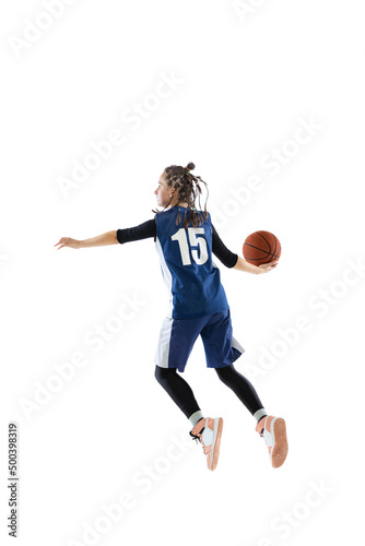 Portrait of young girl, basketball player in blue uniform training isolated over white studio background. Passing ball in a jump. © Lustre Art Group 