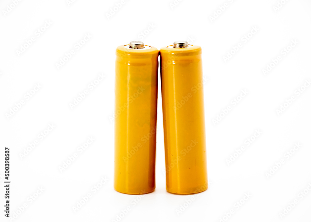 Two yellow AA size batteries isolated on white background Two yellow AA size batteries isolated on white background