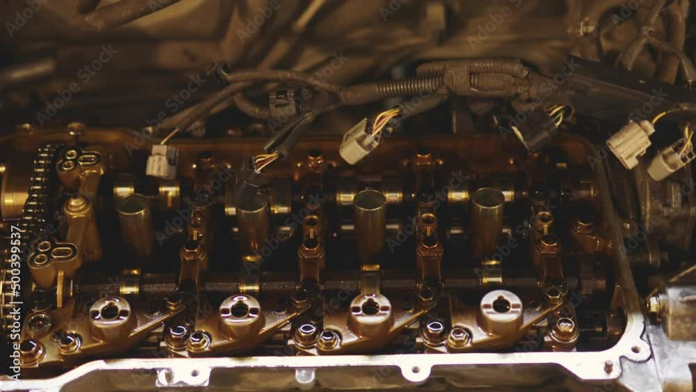 closeup car engine valvematic cover inside and outside, repairmen