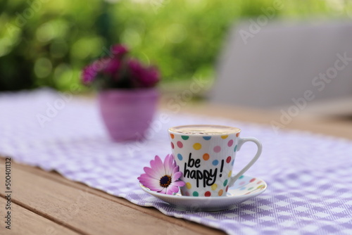 Closeup photography of Turkish coffee with be happy text on it