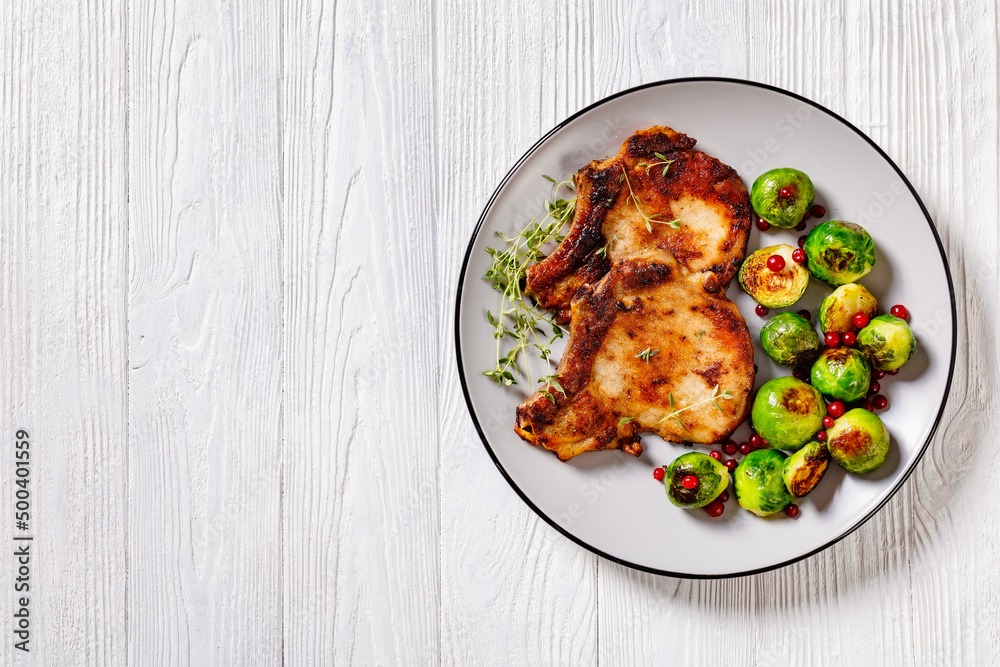 Fototapeta premium bone in loin chops with brussel sprouts