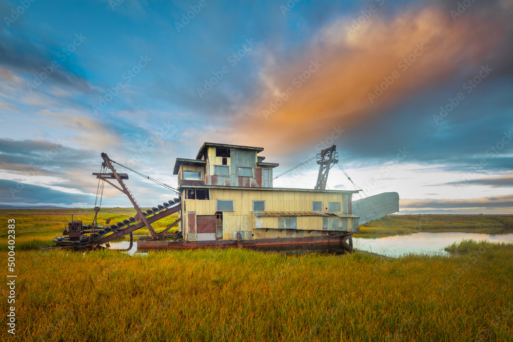 Fototapeta premium Historical wooden gold mining dredge, Nome, arctic Alaska 