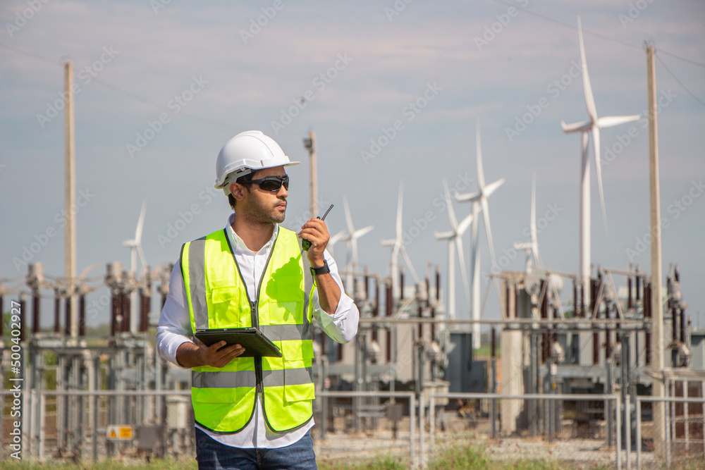 engineer team working in wind turbine farm. Renewable energy with wind generator by alternative energy concept. engineer team working in wind turbine farm. Renewable energy with wind generator by alternative energy concept.
