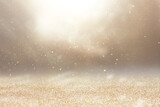 background of abstract gold and silver glitter lights. defocused