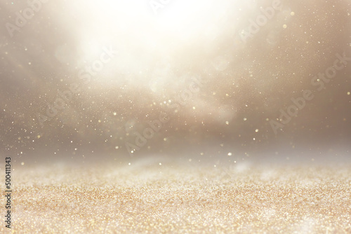 background of abstract gold and silver glitter lights. defocused
