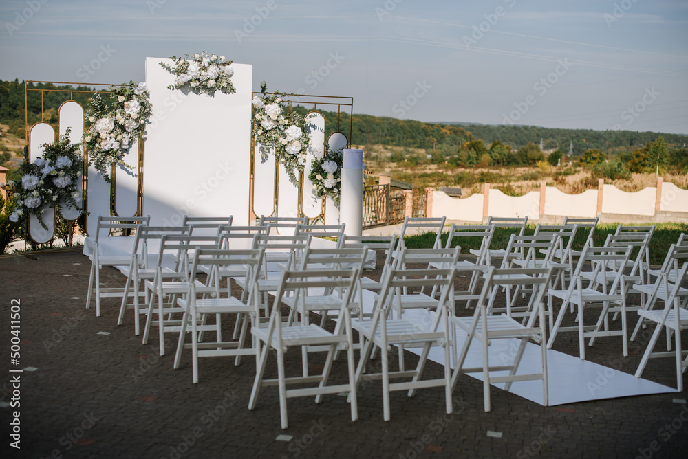 Stylish large arch for a wedding ceremony on the outdoors on a sunny day