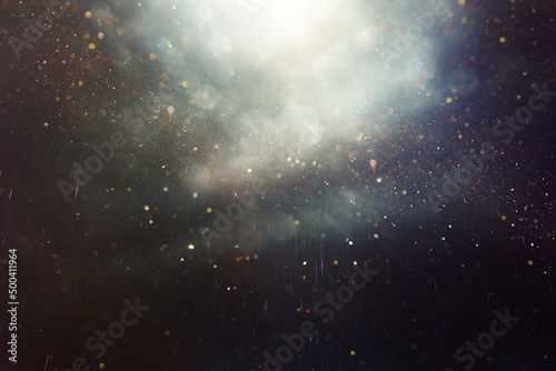 background of abstract glitter lights. gold and black. de focused © tomertu