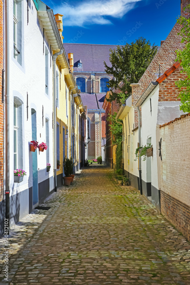 Lier (Begijnhof), Belgium - View on typical belgian narrow cobblestone alley with rural old homes in medieval unesco heritage village