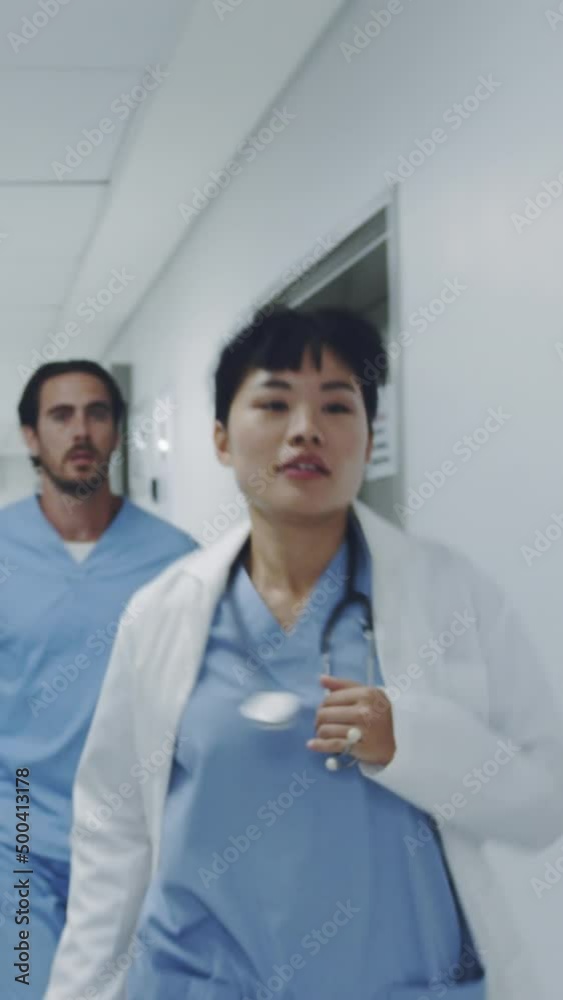 Doctors running through a hospital corridor 4k Doctors running through a hospital corridor 4k